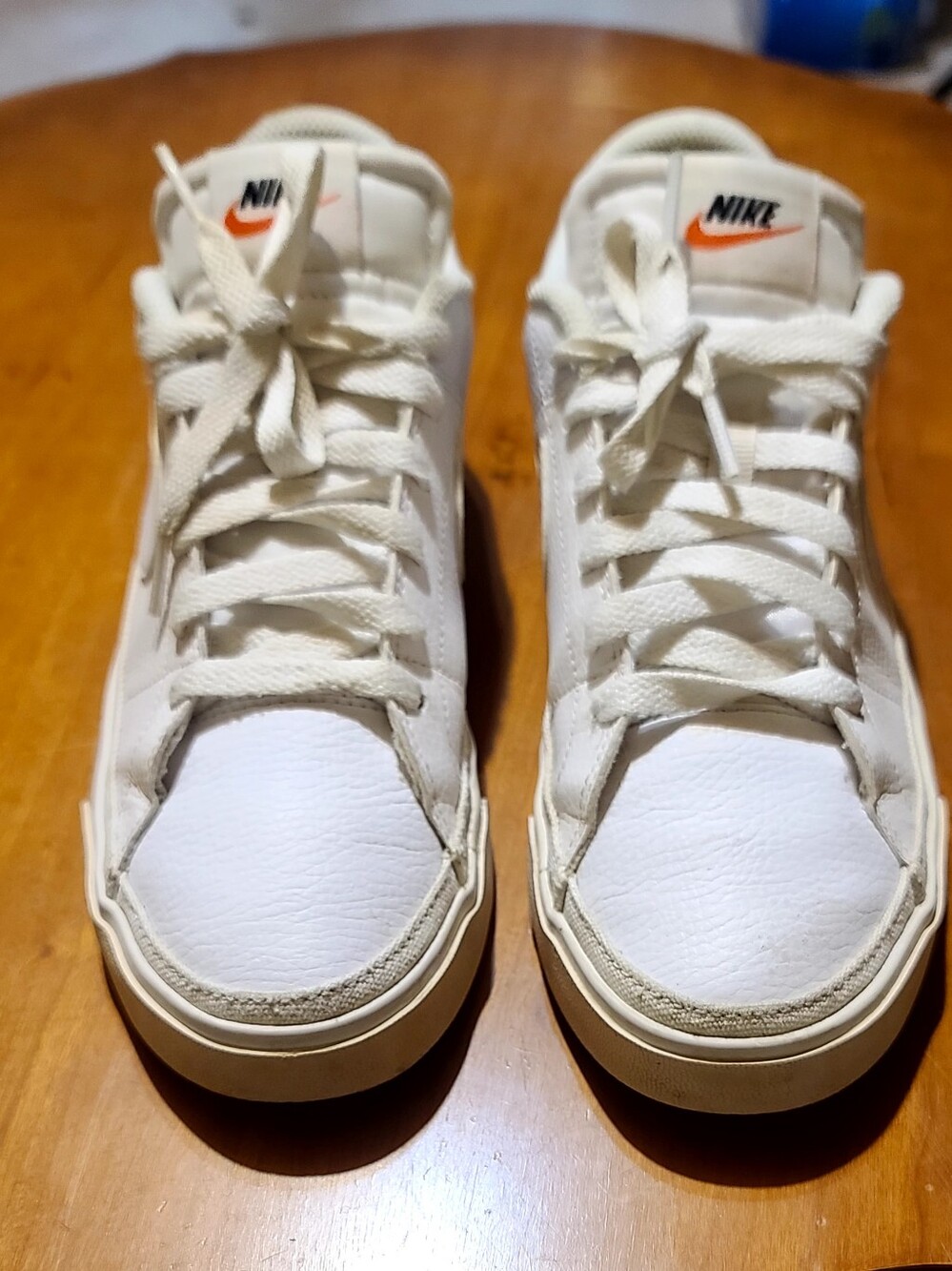Nike White Leather Low-Top Sneakers with Orange Swoosh Accent